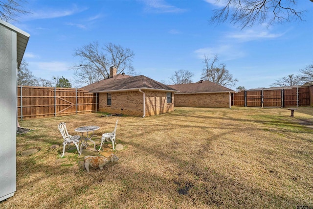 view of yard with a fenced backyard