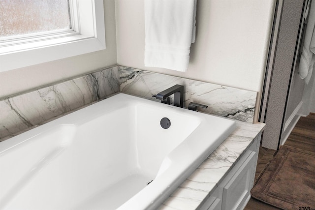 bathroom featuring a washtub