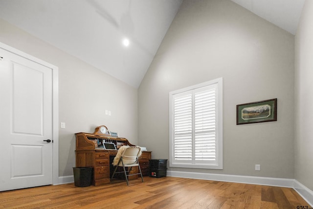 office space featuring lofted ceiling and hardwood / wood-style floors