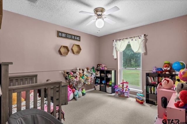 412 Peach Tree Dr, Palestine, TX 75803 - carpeted bedroom featuring a textured ceiling and a ceiling fan