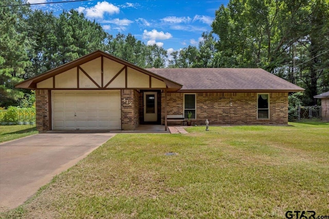 412 Peach Tree Dr, Palestine, TX 75803 - view of front of house featuring an attached garage, driveway, brick siding, a front yard, and roof with shingles