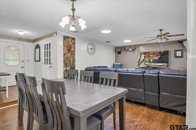412 Peach Tree Dr, Palestine, TX 75803 - dining room featuring a textured ceiling, wood finished floors, and a ceiling fan