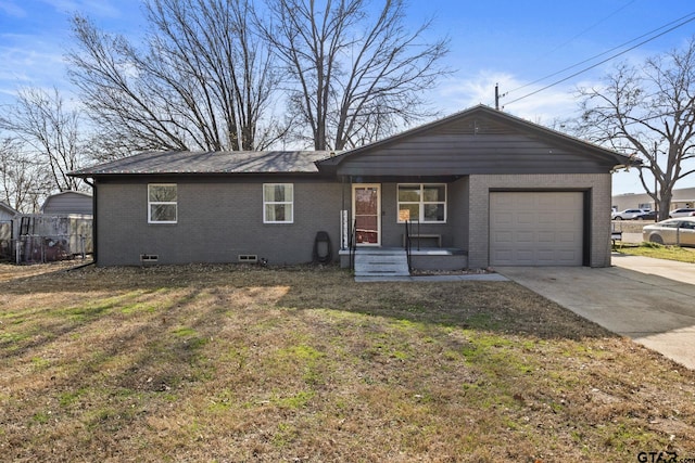 ranch-style home with a garage and a front yard