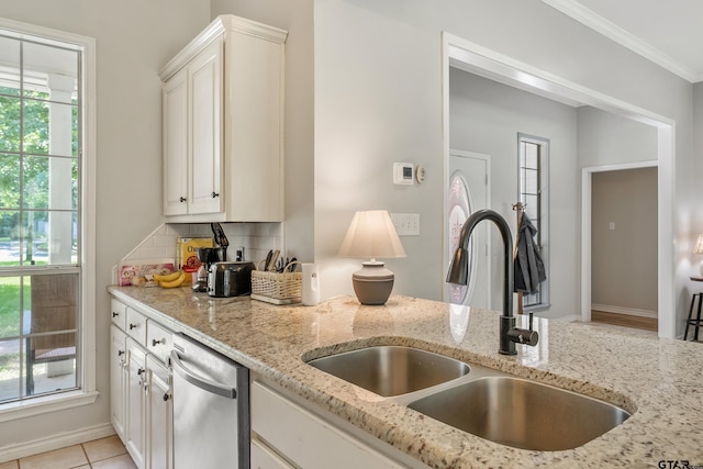 14677 County Road 2337, Tyler, TX 75707 - kitchen with a sink, stainless steel dishwasher, light stone counters, ornamental molding, and white cabinets