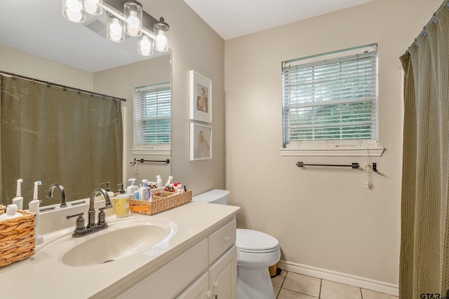 14677 County Road 2337, Tyler, TX 75707 - bathroom featuring tile patterned floors, toilet, and vanity