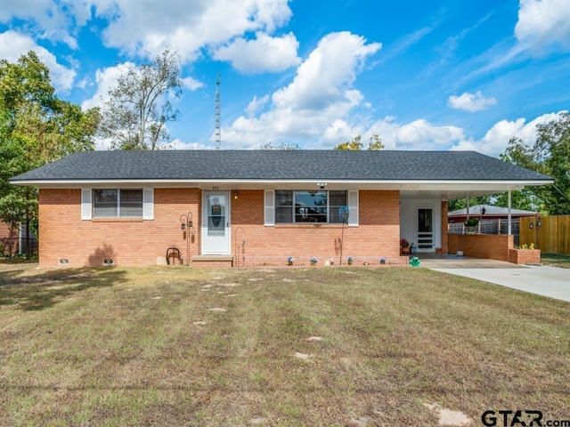 single story home featuring a carport and a front lawn