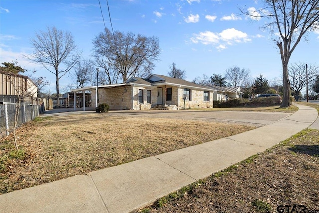 ranch-style home with a front lawn