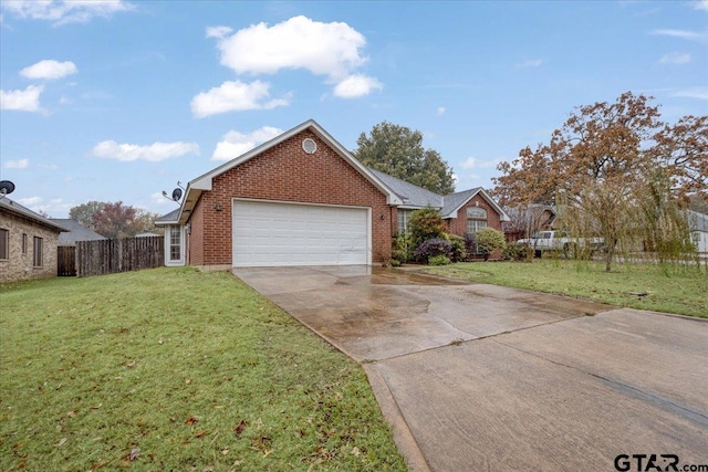 view of front facade with a garage and a front lawn