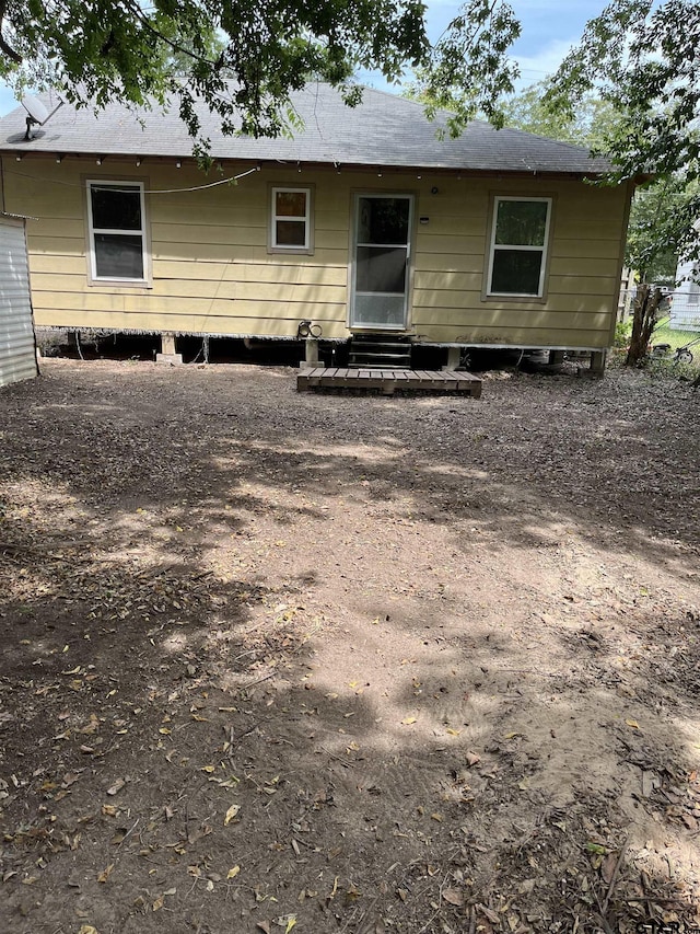 back of house with entry steps