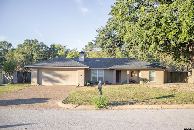 ranch-style home featuring a garage and a front lawn