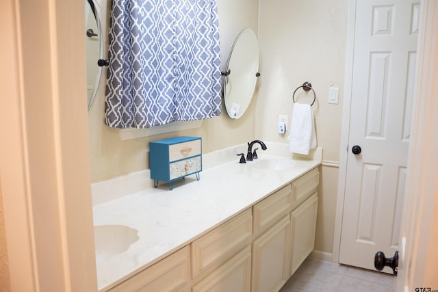 bathroom with vanity and tile patterned floors