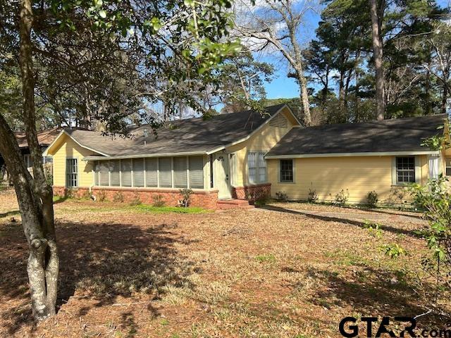 single story home with brick siding