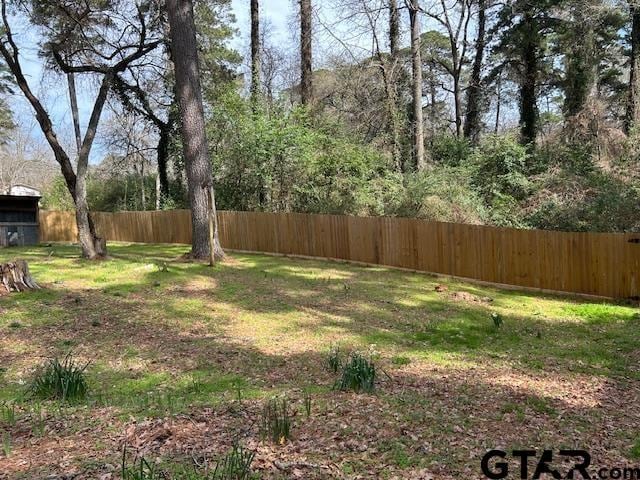 view of yard with fence