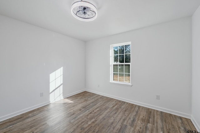 spare room with wood-type flooring