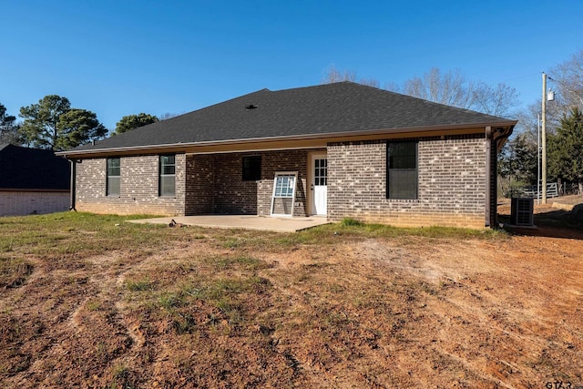 back of property with a patio