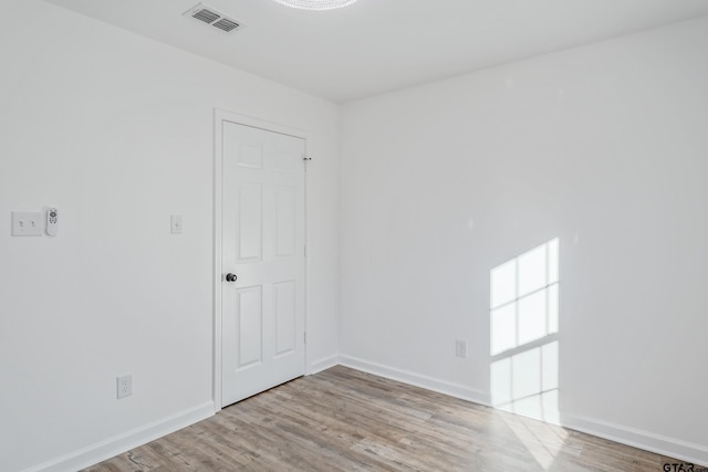 unfurnished room featuring light wood-type flooring