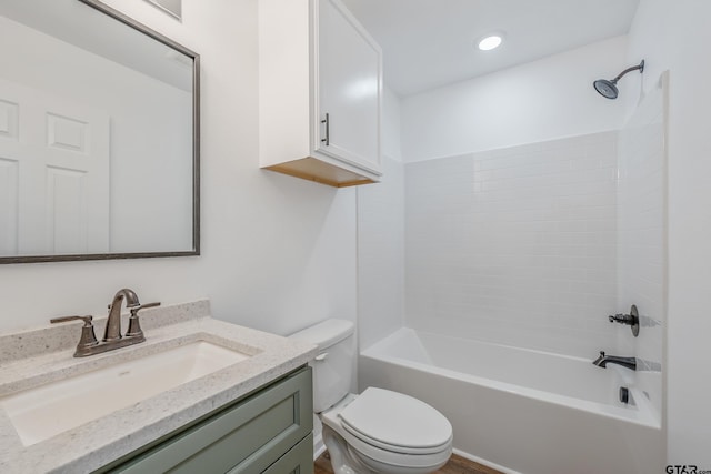 full bathroom with vanity, tub / shower combination, and toilet