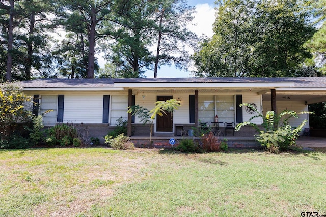 single story home featuring a porch and a front yard