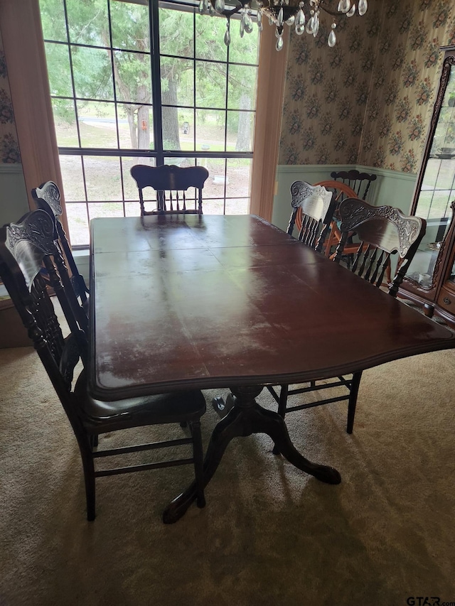 507 E Longview St, Arp, TX 75750 - carpeted dining area with wallpapered walls, a wainscoted wall, and plenty of natural light