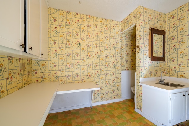 507 E Longview St, Arp, TX 75750 - bathroom featuring wallpapered walls and vanity