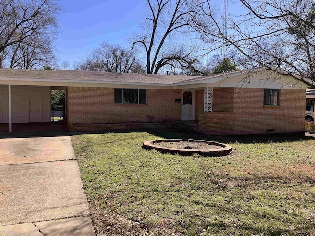 ranch-style house with a carport, concrete driveway, brick siding, and a front lawn