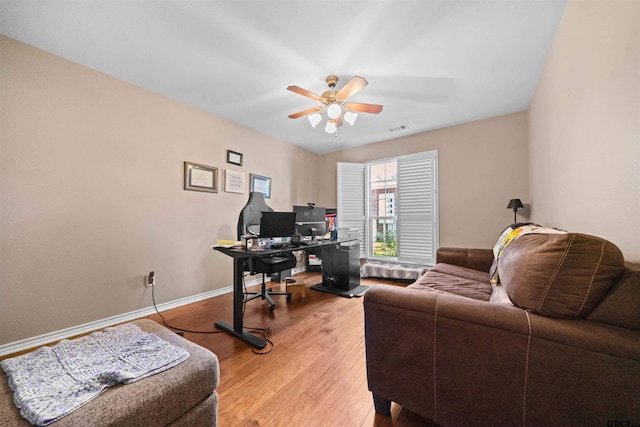 1521 Rice Rd # A105, Tyler, TX 75703 - office area featuring a ceiling fan, wood finished floors, and baseboards