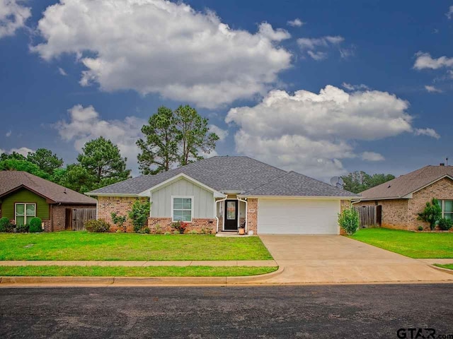 ranch-style home with board and batten siding, an attached garage, a front lawn, and brick siding