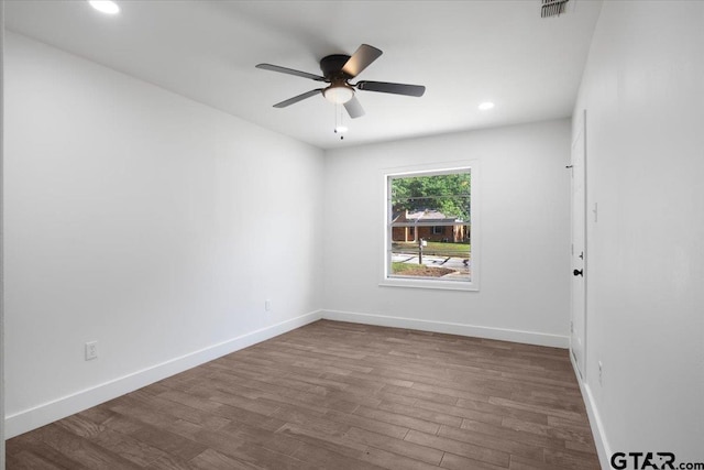 1612 Woodland Hills Dr, Tyler, TX 75701 - unfurnished room with dark wood-style flooring, ceiling fan, and recessed lighting