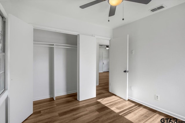 1612 Woodland Hills Dr, Tyler, TX 75701 - unfurnished bedroom with wood finished floors, a closet, and ceiling fan