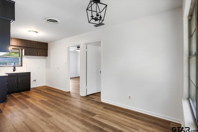 1612 Woodland Hills Dr, Tyler, TX 75701 - unfurnished living room with dark wood-style flooring and a ceiling fan