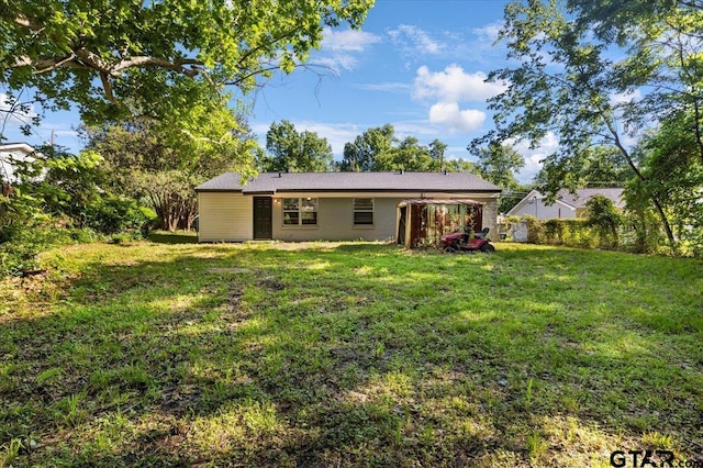 1612 Woodland Hills Dr, Tyler, TX 75701 - back of property featuring a lawn