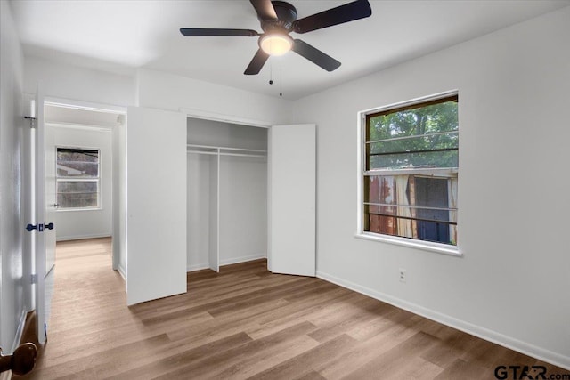 1612 Woodland Hills Dr, Tyler, TX 75701 - unfurnished bedroom featuring wood finished floors, a closet, and ceiling fan