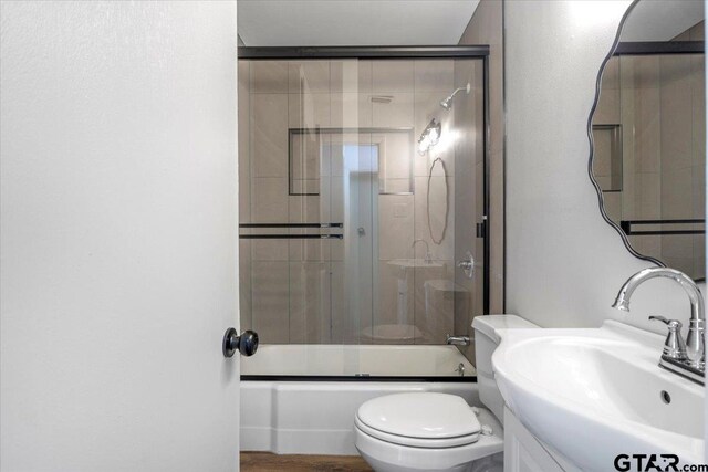 1612 Woodland Hills Dr, Tyler, TX 75701 - full bath with vanity and enclosed tub / shower combo
