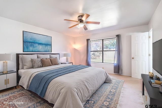 carpeted bedroom featuring ceiling fan