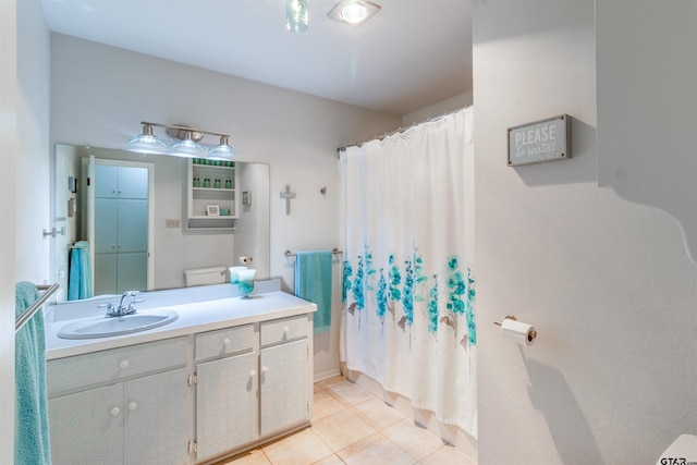 bathroom with tile patterned flooring, vanity, a shower with curtain, and toilet