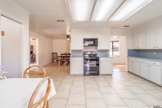 kitchen featuring light tile patterned floors, white cabinets, ceiling fan, and black appliances