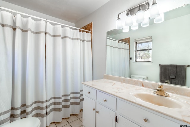 full bathroom featuring curtained shower, vanity, toilet, and tile patterned floors