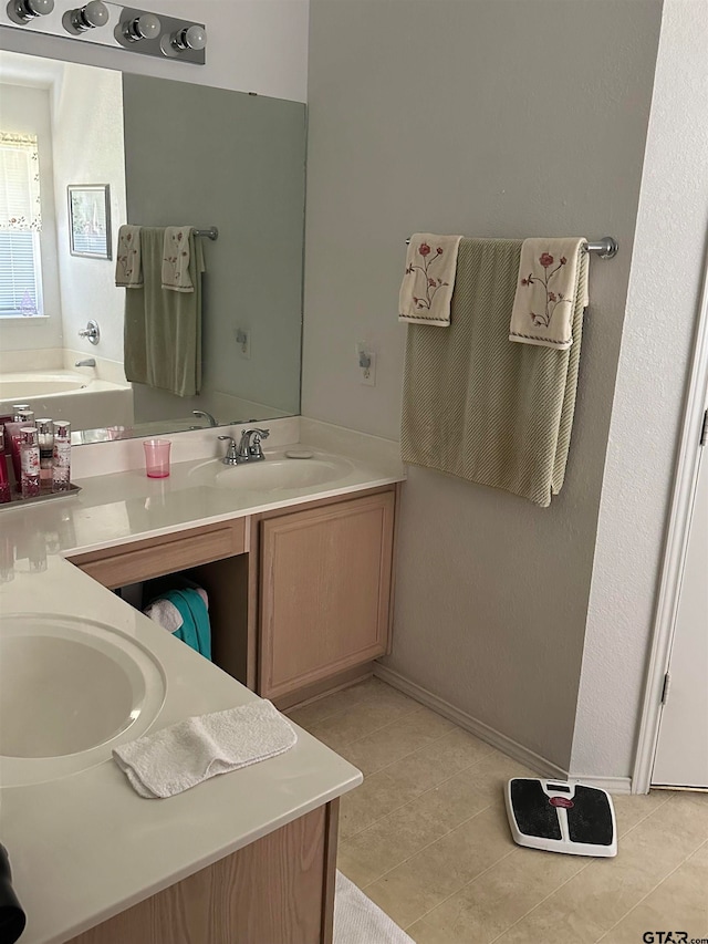 bathroom with vanity and tile patterned floors