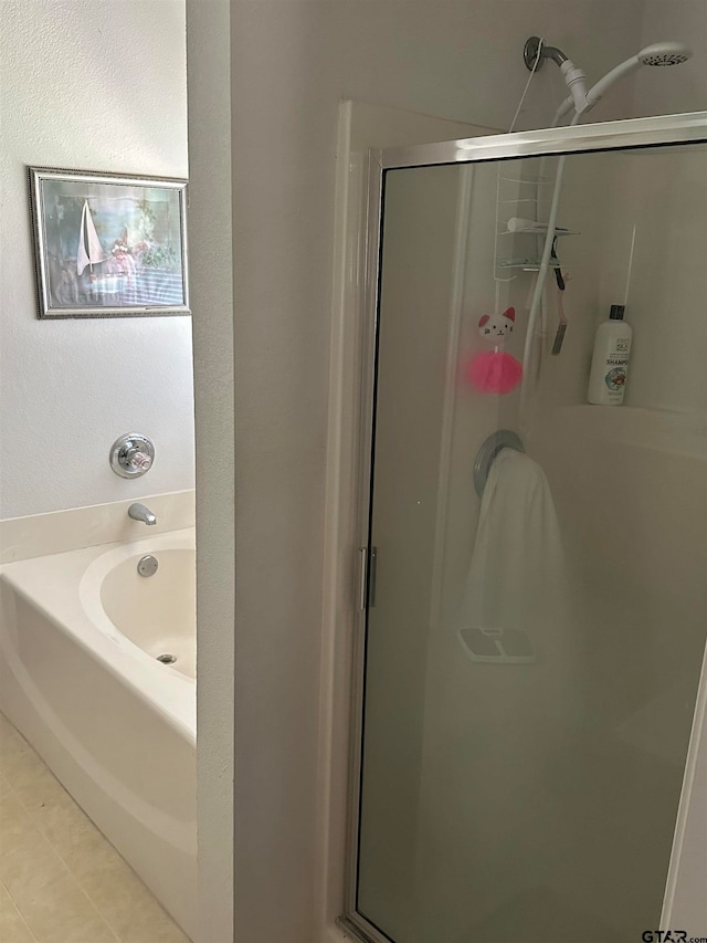 bathroom featuring independent shower and bath and tile patterned floors