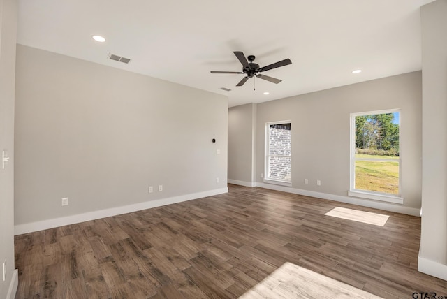 empty room featuring ceiling fan and dark hardwood / wood-style floors