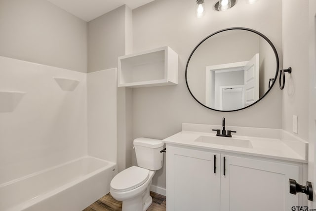 full bathroom with toilet, shower / tub combination, vanity, and hardwood / wood-style flooring