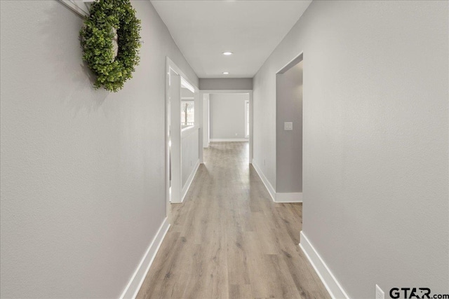 hallway featuring light hardwood / wood-style flooring