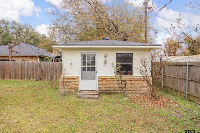 view of outdoor structure with a yard