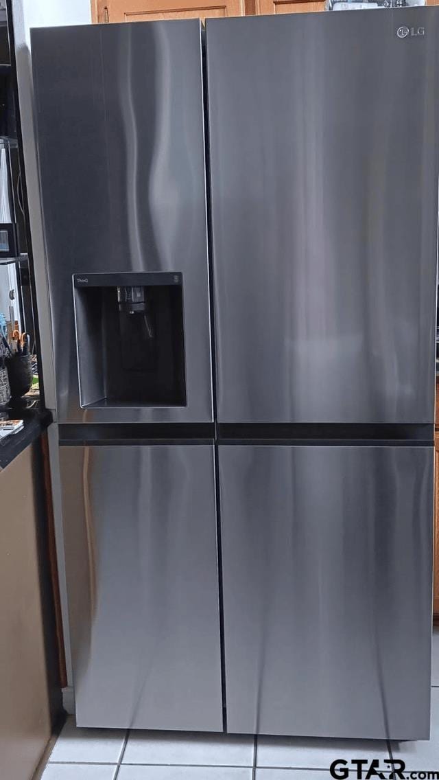 interior details with stainless steel fridge with ice dispenser