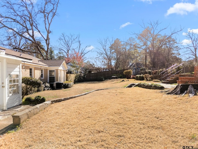 view of yard with central AC