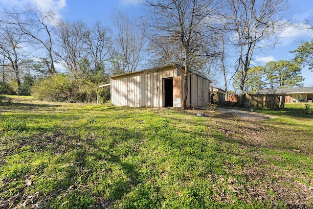 view of outbuilding with a lawn