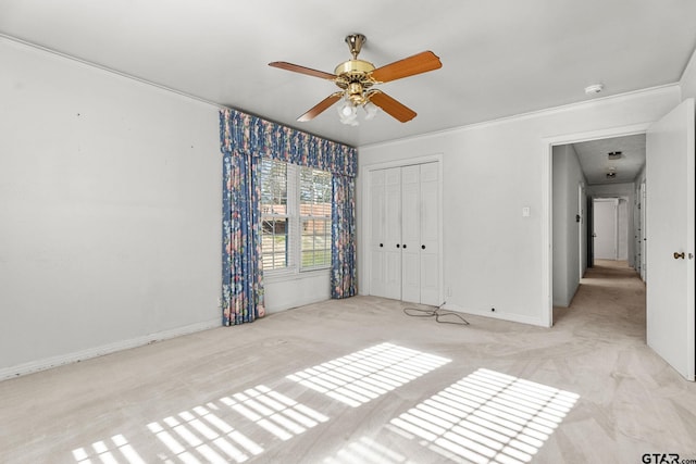 unfurnished room with crown molding and ceiling fan