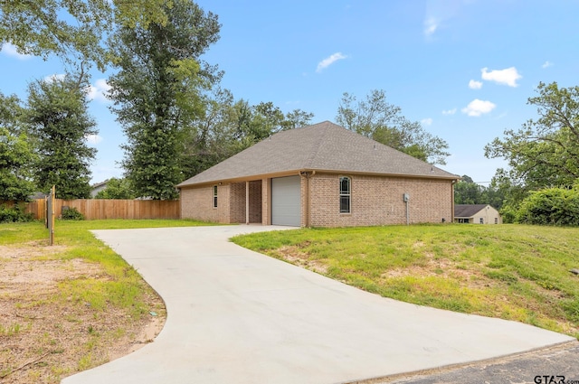 view of property exterior featuring a yard and a garage