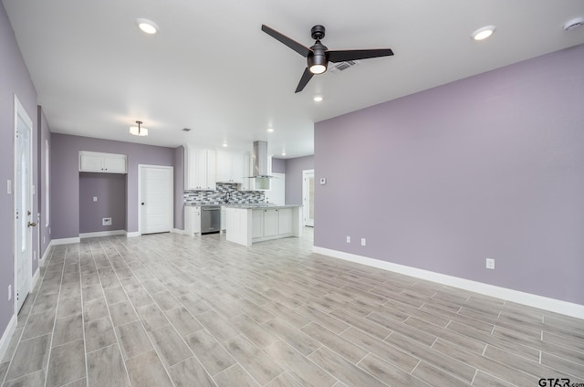 unfurnished living room with light hardwood / wood-style floors and ceiling fan