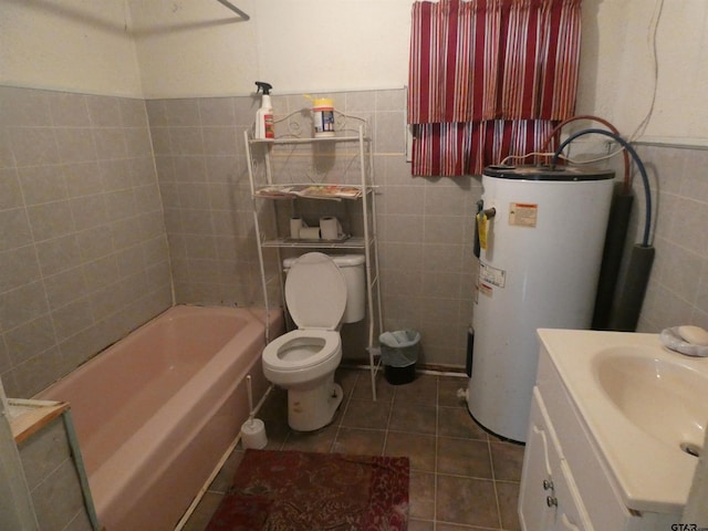 full bathroom featuring toilet, tile walls, vanity, tile patterned flooring, and water heater